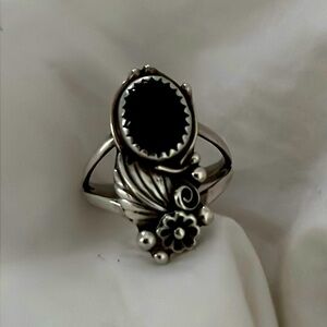 Sterling silver and onyx ring. Size 8 1/2, polished.